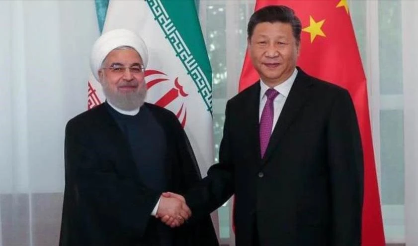 Los presidentes de Irán, Hassan Rouhani (izquierda) y de China, Xi Jinping.