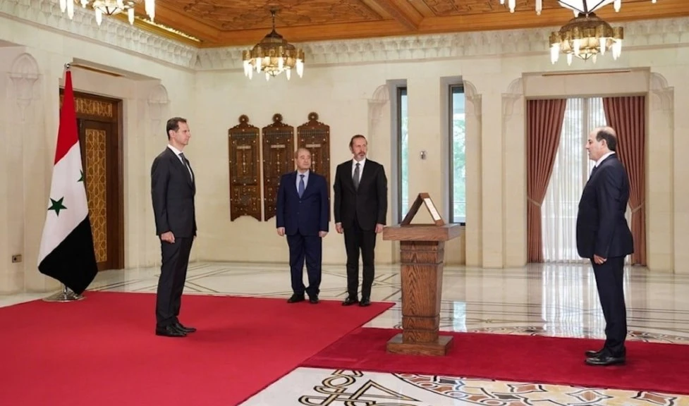 Mohammad Mohammad prestó juramento legal ante el presidente de Siria, Bashar al-Assad. Mohammad Mohammad prestó juramento legal ante el presidente de Siria, Bashar al-Assad.