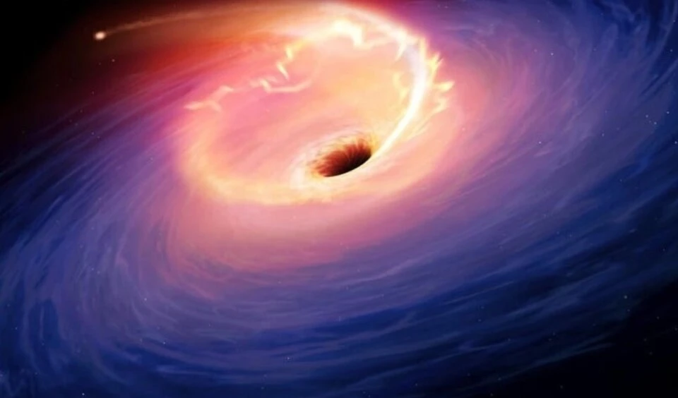Una estrella absorbida por un agujero negro. Imagen: AFP.