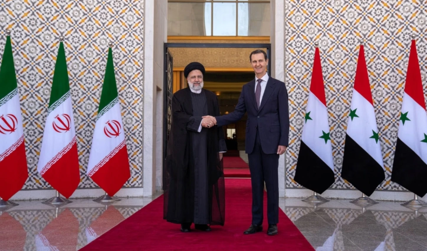 El presidente iraní, Ebrahim Raisi y su homólogo sirio, Bashar al-Assad.