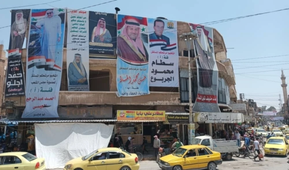 : Carteles para los candidatos a la Asamblea Popular de Siria en la gobernación de Hasakeh. Foto: Al Mayadeen : Carteles para los candidatos a la Asamblea Popular de Siria en la gobernación de Hasakeh. Foto: Al Mayadeen